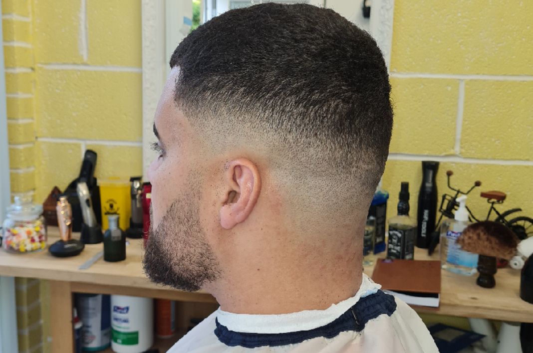 Skin fade with beard line-up